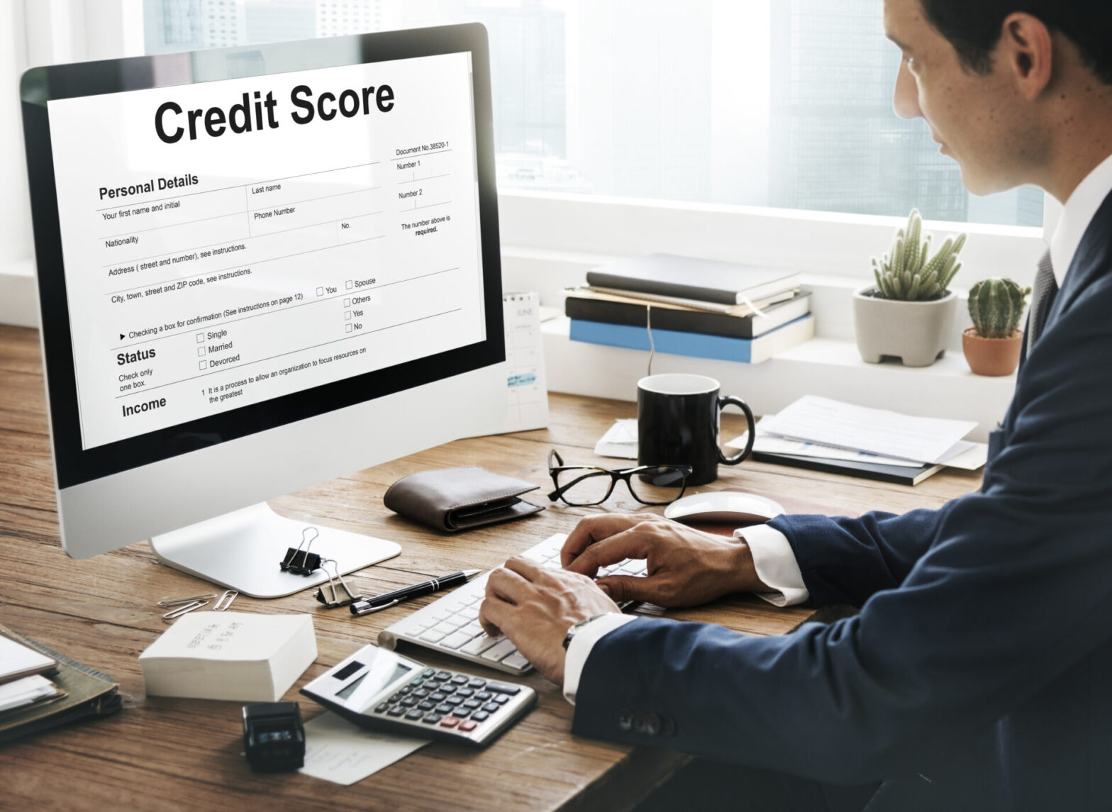 Business owner analyzing financial documents to protect business credit score during debt restructuring.